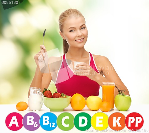 Image of happy woman with organic food and vitamins