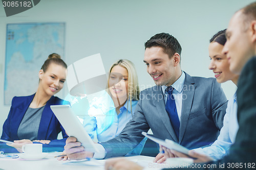 Image of business team with tablet pc having discussion
