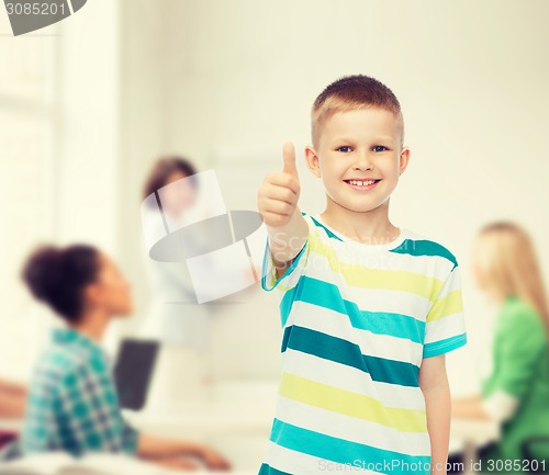 Image of little boy in casual clothes with arms crossed
