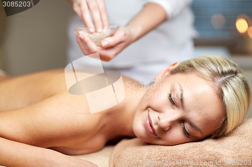 Image of close up of woman lying and having massage in spa