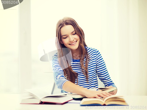 Image of happy smiling student girl with books