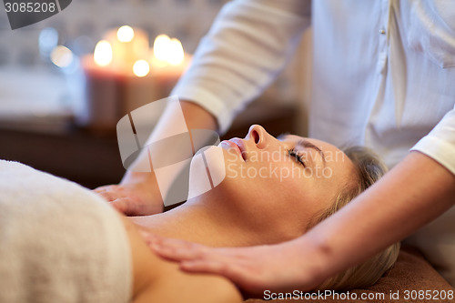 Image of close up of woman lying and having massage in spa