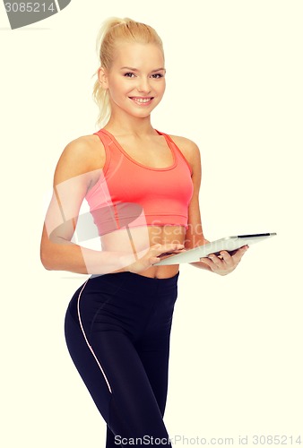 Image of smiling sporty woman with tablet pc computer