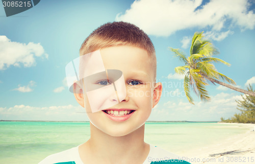 Image of smiling little boy over green background