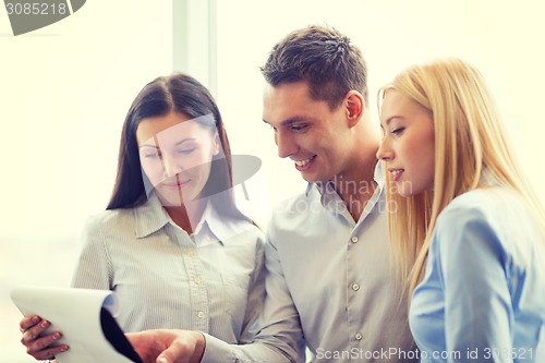 Image of business team looking at clipboard