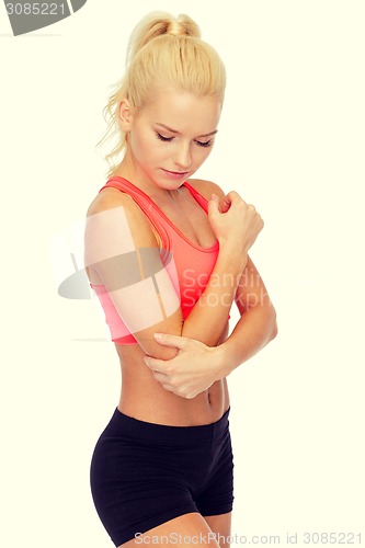 Image of sporty woman with pain in elbow