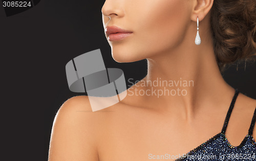 Image of woman with diamond earrings