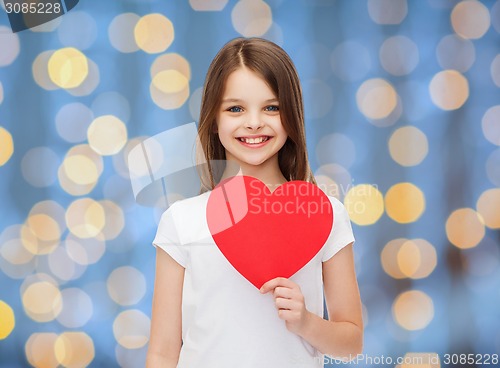 Image of smiling little girl with red heart