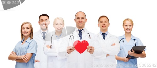 Image of group of smiling doctors with red heart shape