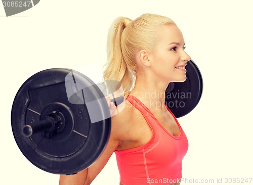 Image of smiling sporty woman exercising with barbell