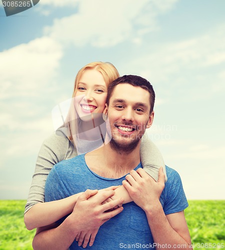 Image of smiling couple hugging