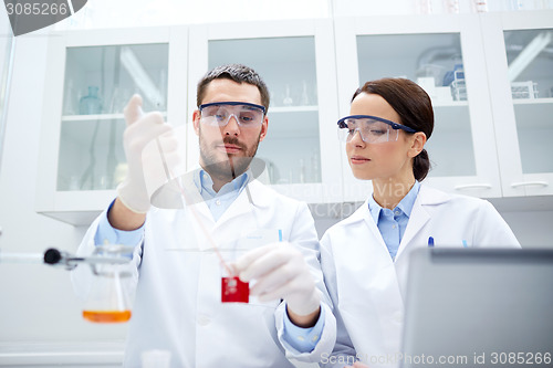 Image of young scientists making test or research in lab