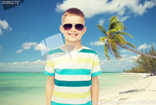 Image of smiling little boy over green background