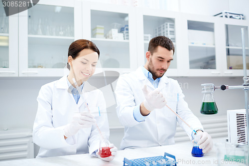 Image of young scientists making test or research in lab