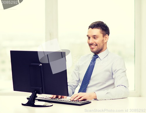 Image of smiling businessman or student with computer