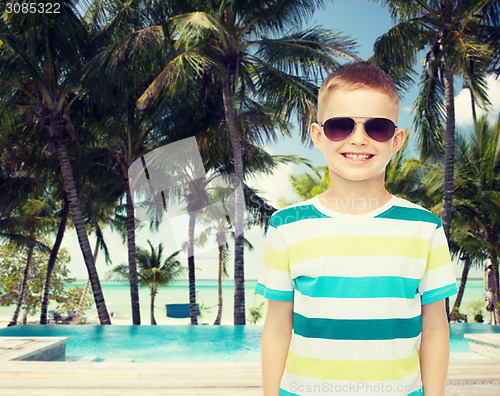 Image of smiling little boy over green background