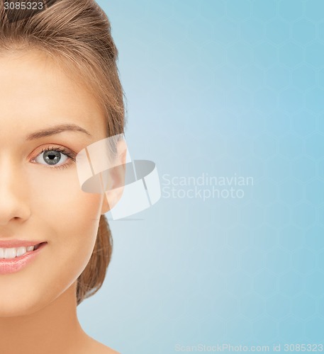 Image of beautiful young woman half face