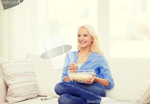 Image of young girl with popcorn ready to watch movie
