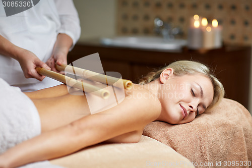 Image of close up of woman lying and having massage in spa