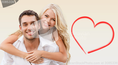 Image of happy couple having fun over beige background