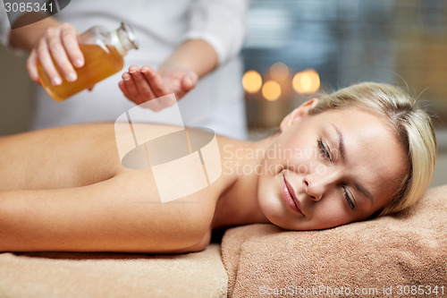 Image of close up of woman lying on massage table in spa