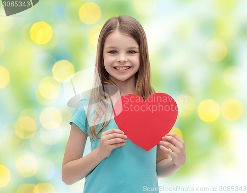 Image of smiling little girl with red heart