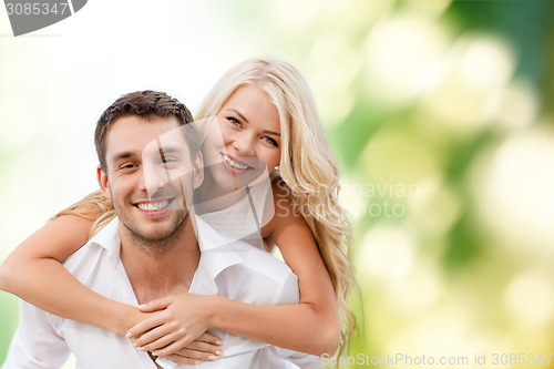 Image of happy couple having fun over green background