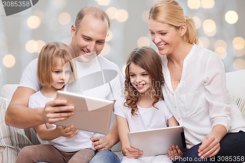 Image of family and two kids with tablet pc computers