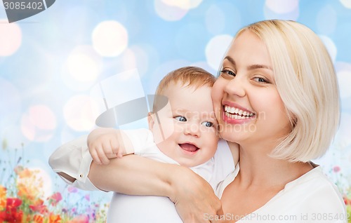 Image of happy mother with baby over natural background