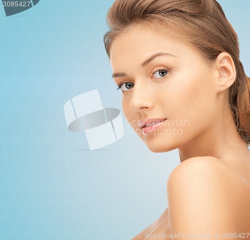 Image of beautiful young woman with bare shoulders