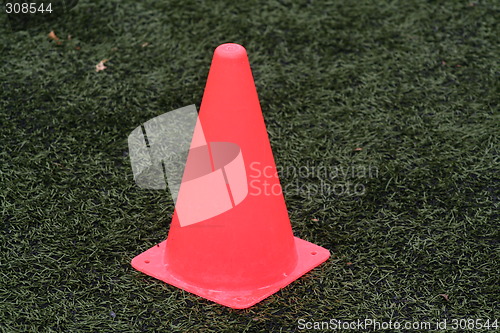 Image of Orange cone on fotball field