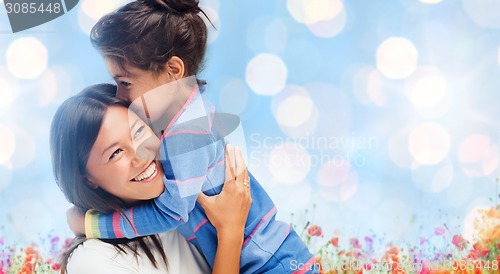 Image of happy mother and daughter hugging