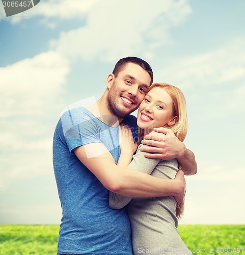 Image of smiling couple hugging