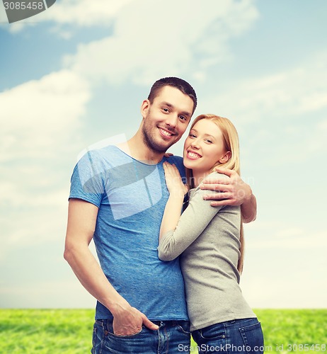 Image of smiling couple hugging