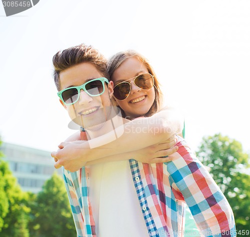 Image of smiling couple having fun in park