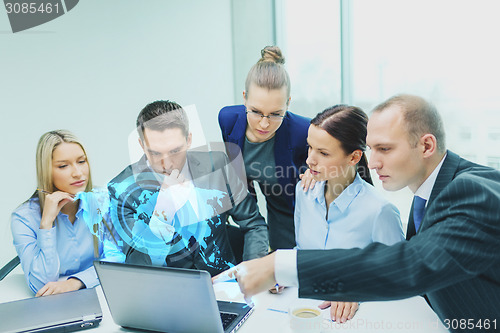 Image of business team with laptop having discussion