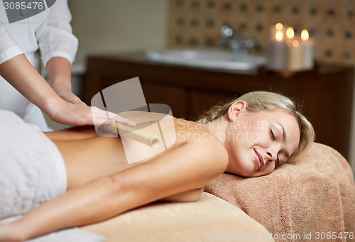 Image of close up of woman lying and having massage in spa