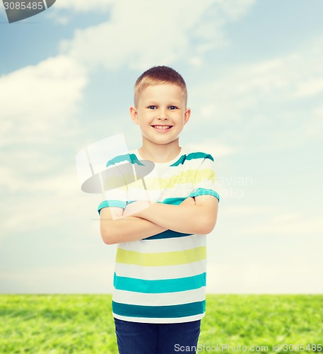 Image of little boy in casual clothes with arms crossed