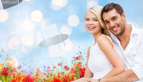 Image of happy couple having fun over poppy flowers field