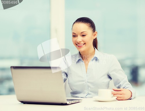 Image of smiling businesswoman or student with laptop