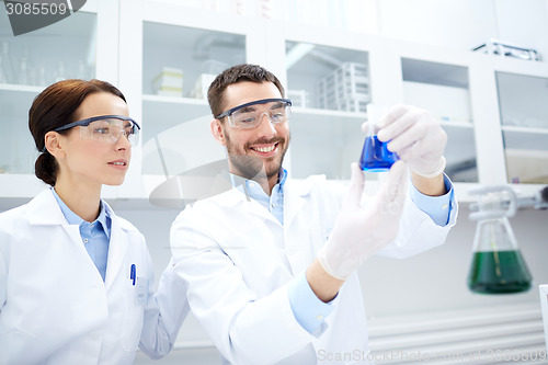 Image of young scientists making test or research in lab