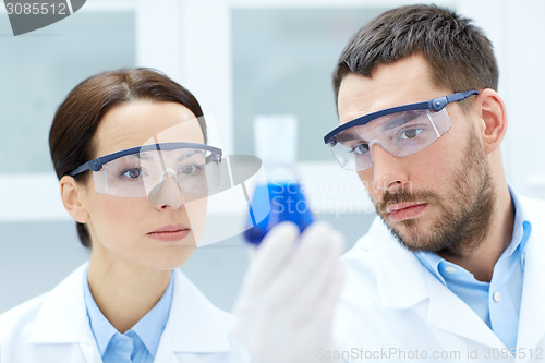 Image of young scientists making test or research in lab