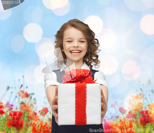 Image of happy smiling girl with gift box