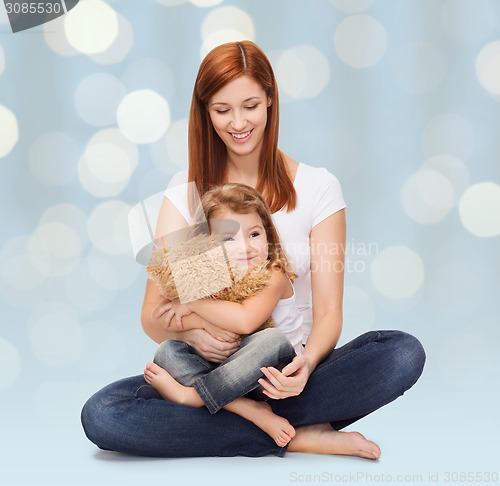 Image of happy mother with adorable girl and teddy bear