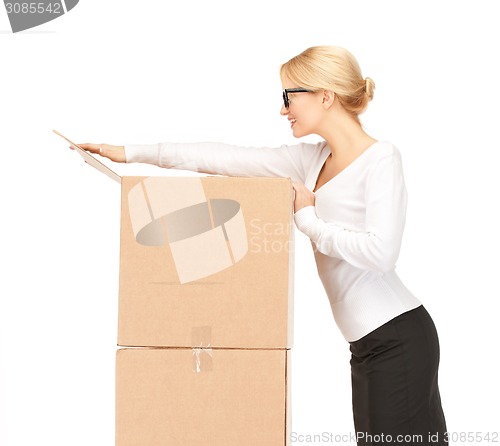 Image of businesswoman with big boxes