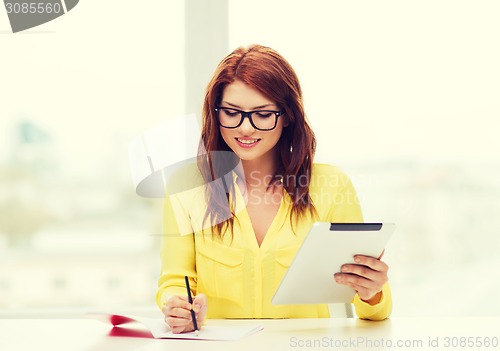 Image of student with tablet pc computer and notebook