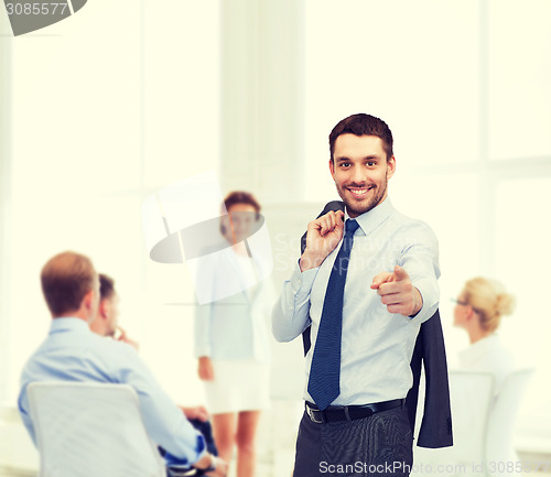 Image of handsome buisnessman with jacket over shoulder