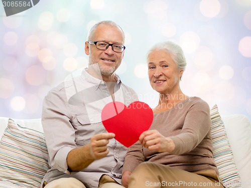 Image of happy senior couple with red heart shape