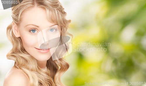 Image of face of beautiful young happy woman with long hair