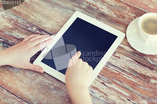 Image of female pointing finger to tablet pc screen